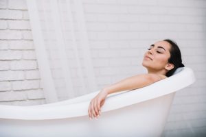 woman-taking-relaxing-bath-spa_23-2148176858